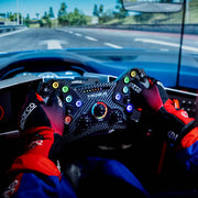 MOZA RACING KS Steering Wheel close up action shot mounted to a racing rig